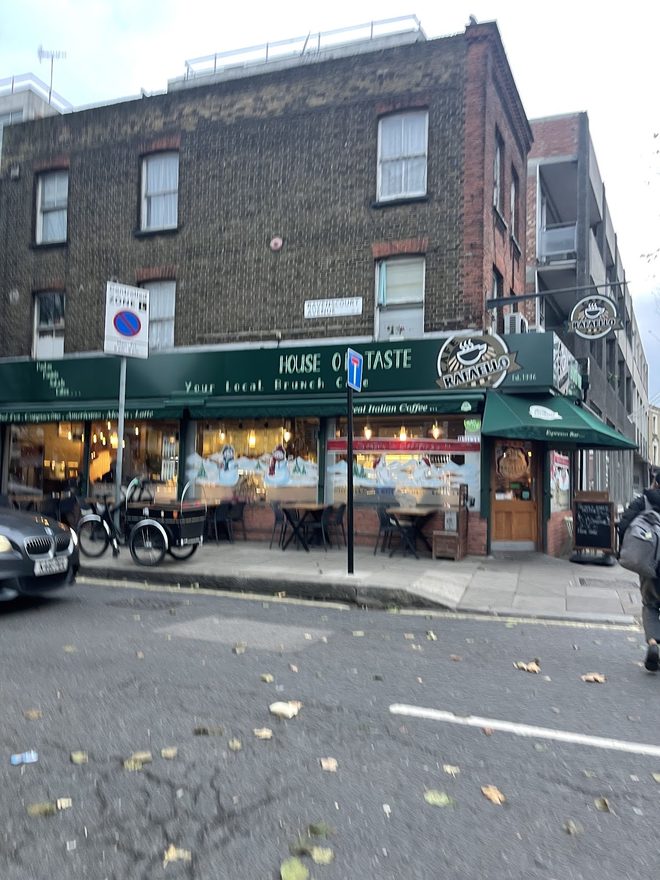 The shopfront and green awning from across King Street
