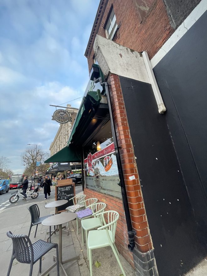 Looking along the parade towards the awning and outdoor tables